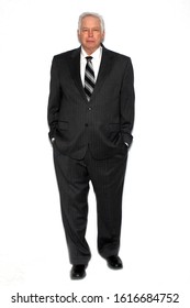 Business Man. A Business Man In A Pin Striped Suit. Isolated On White. Room For Text. Clipping Path. Business Men World Wide Create And Run Businesses And Keep The World Of Business Running. 