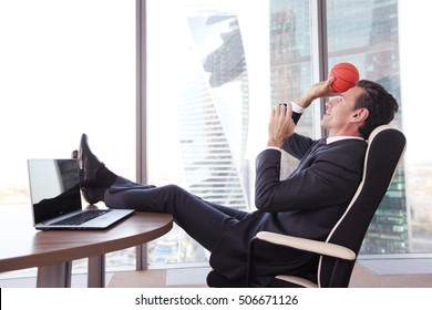 Business Man Playing With A Basketball At The Office