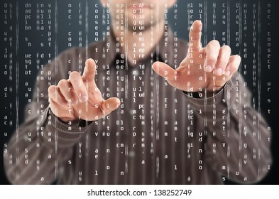 Business man pointing at code list on digital touchscreen