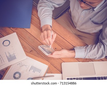Business man pointing to digital tablet computer with financial graph in the conference.Business meeting time working with new startup project.presentation concept, Accounting analyze plans.
