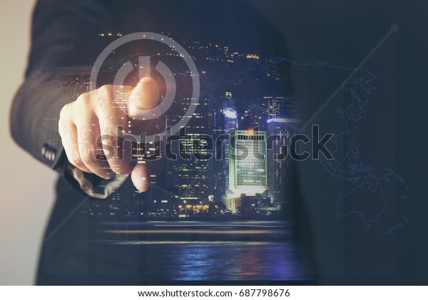 Business man pointing at growth graph\
and business concept. investment, business, future technology and\
money concept - closeup of man hand pointing at\
chart.