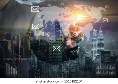 Business Man With Pointing To Something Or Touching A Touch Screen Overlay With Cityscape And World Map. Business And Technology Concept. Double Exposure