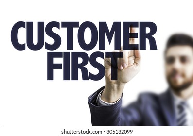 Business Man Pointing The Text: Customer First