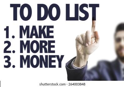 Business man pointing the text: To Do List - Make More Money