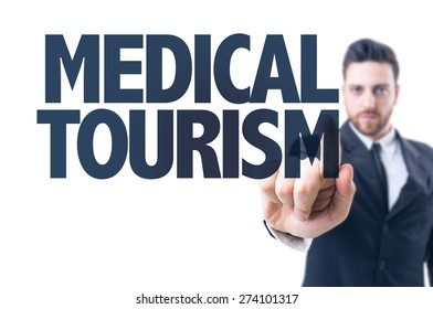 Business man pointing the text: Medical Tourism