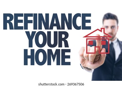 Business Man Pointing The Text: Refinance Your Home