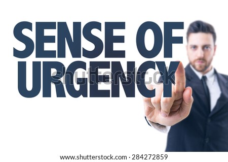 Business man pointing the text: Sense of Urgency