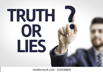 Business man pointing to transparent board with text: Truth or Lies? 