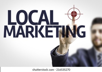 Business Man Pointing To Transparent Board With Text: Local Marketing