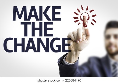 Business Man Pointing To Transparent Board With Text: Make The Change