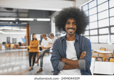 Business man, portrait and arms crossed in creative office with confidence for startup career or internship opportunity. Young and worker or graphic designer smile for cool job in workspace. - Powered by Shutterstock