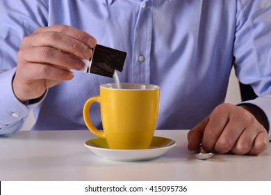 Business Man Pouring Sugar Bag On Yellow Coffee Cup