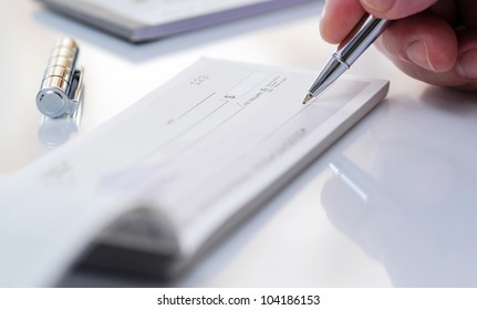 Business man prepare writing a check - Shutterstock ID 104186153