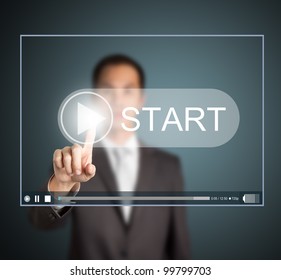 Business Man Pressing Start Button To Play Video Clip