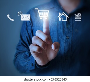 Business man pressing a touchscreen button - Shutterstock ID 276520343