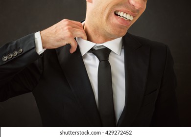 Business Man Pulling His Shirt Of His Neck