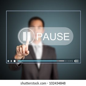 Business Man Push Pause Button On Touch Screen To Hold Video Clip