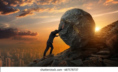 Business man pushing large stone up to hill , Business heavy tasks and problems concept. - Shutterstock ID 687578737
