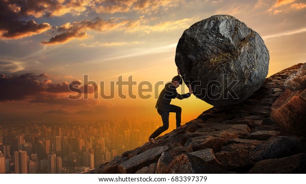 Business man pushing large stone up to\
hill , Business heavy tasks and problems\
concept.