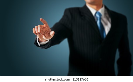 Business Man pushing on a touch screen interface - Powered by Shutterstock