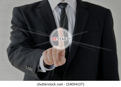 Business Man Pushing Restart Button