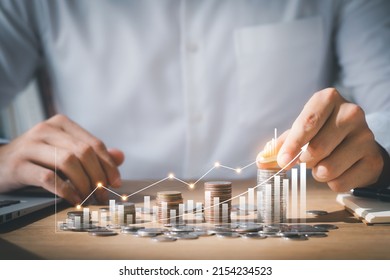 Business man putting coins Business growth and investment chart, strategic planning to increase profits from doing business, long-term investment planning.