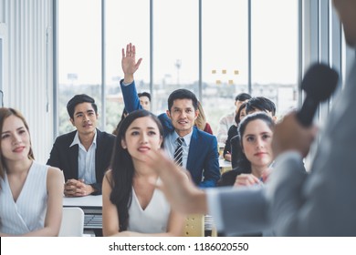 Business Man Raising Hand For Asking Speaker For Question And Answer Concept In Meeting Room For Seminar