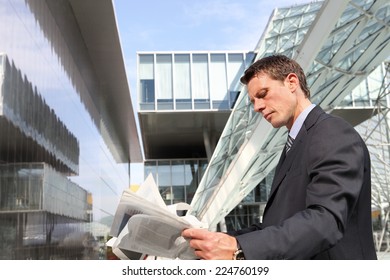 Business Man Reading The Financial Newspaper