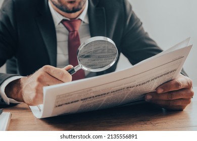 Business man reading newspaper with magnifying
 - Powered by Shutterstock