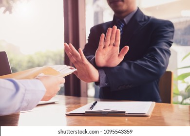 Business man refusing money to take the bribe the concept of corruption and anti bribery - Shutterstock ID 1095543359