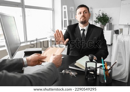 Business man refusing to take bribe in office