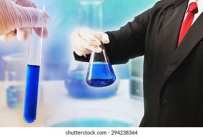 Business Man Research Chemistry At Science Lab , Pharmaceutical Concept Background 