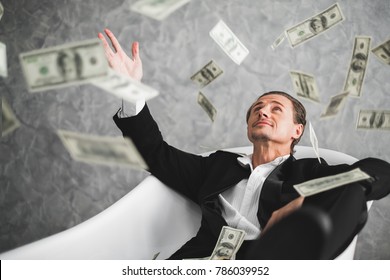 Business man, rich, millionaire, billionaire, with many banknote dollars money - Shutterstock ID 786039952