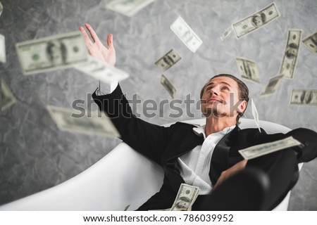 Business man, rich, millionaire, billionaire, with many banknote dollars money