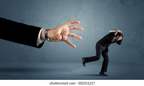 Business Man Running Away From A Huge Hand Concept On Background