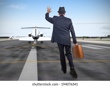 Business Man Running Behind A Plane 