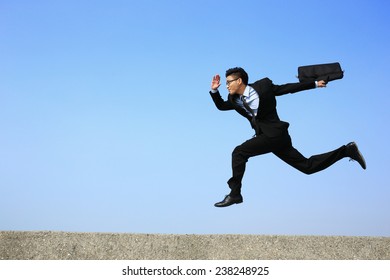 Business Man Running With Blue Sky Background, Full Length, Asian Male