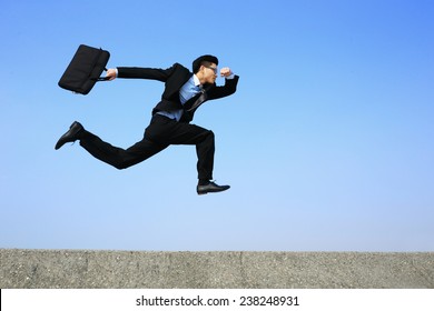 Business Man Running With Blue Sky Background, Full Length, Asian Male