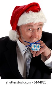 Business Man In Santa Hat Blowing Party Blower