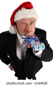 Business Man In Santa Hat Blowing Party Blower