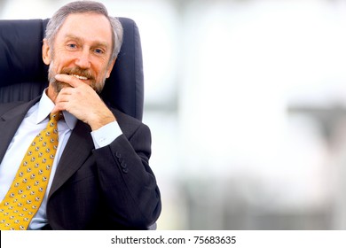 Business Man Seated On A Chair