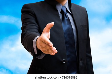 Business Man Shack Hand  Template In Sky Background.