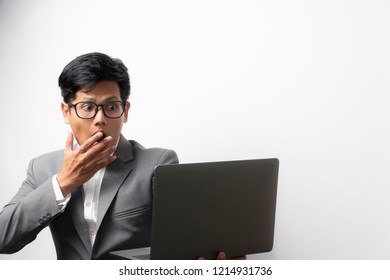 A Business Man With Shock Expression On Face While Looking At The Laptop Computer Screen. Happily Shock. 