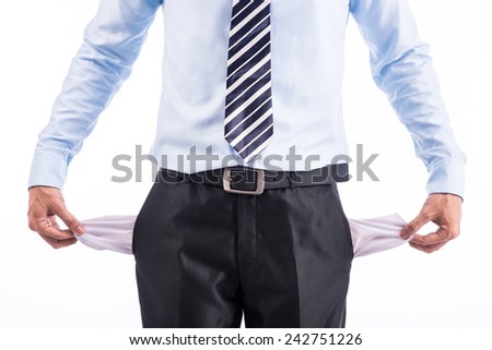Business man showing his empty pockets on white background. 