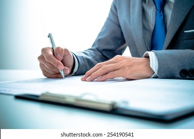 Business Man Signing A Contract