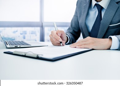 Business Man Signing A Contract