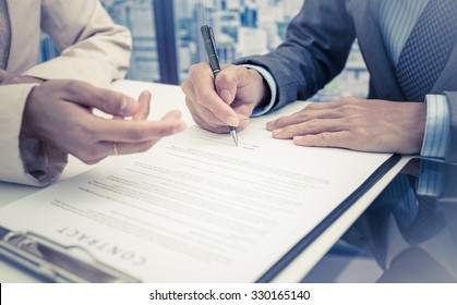 Business Man Signing A Contract