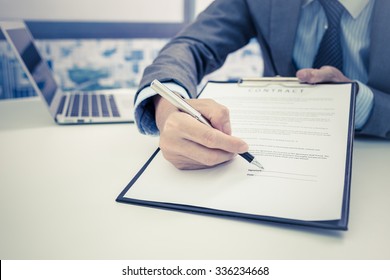 Business Man Signing A Contract