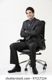 Business Man Sitting On Office  Chair Crossing Arm