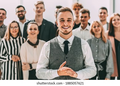 business man standing in front of a group of diverse young peop